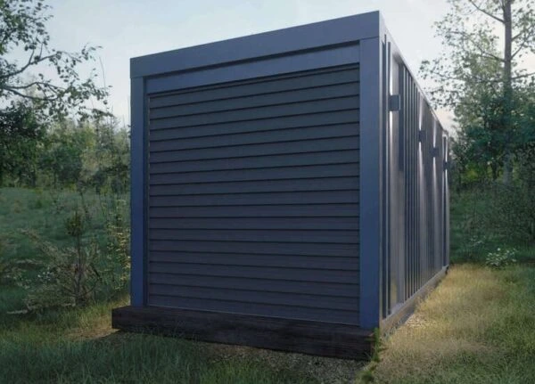 Dark-grey-shipping-container-building-in-forest-Reborn-Buildings