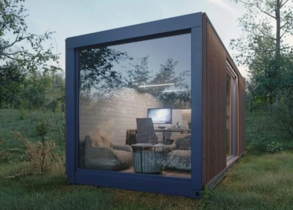 Shipping-container-office-with-glass-front-wall-in-forest-Reborn-Buildings